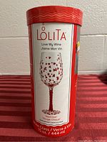 Front of original packaging showing Lolita Love My Wine Glass "Red Hot" with red heart pattern and red stem.