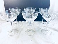 Front view of all 6 crystal wine glasses showing their shape and pattern.