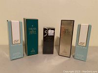 Five boxed women's fragrances including two identical Estée Lauder Youth Dew, Elizabeth Taylor Diamonds and Emeralds, White Diamonds, and White Diamonds Night fragrances