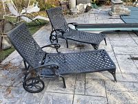 Both loungers side by side on stone patio, showing overall shape and condition