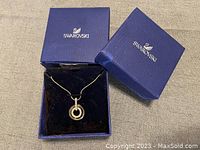 Full view of Swarovski necklace in original blue box with black velvet interior.