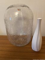Overall view of both vases side by side showing size, shape and texture.