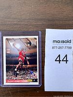 Front view of the 1992 Michael Jordan basketball card in plastic sleeve showing Jordan dunking in Chicago Bulls uniform.