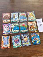 Overview of 14 vintage Pokémon cards arranged on surface with label.