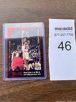 Front view of 1999 Michael Jordan basketball trading card featuring action shot and stats text.