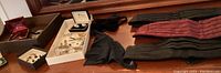 Overview photo showing a collection of men's dress accessories including watches, cuff links, and cummerbunds.