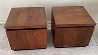 Front and top view showing two square wood cube tables side by side, highlighting shape and wood grain.
