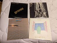 Photo of the front covers of four vinyl LP albums: Genesis (From Genesis to Revelation), Peter Gabriel (self-titled), Brand X (Unorthodox Behaviour), and Genesis (Duke).