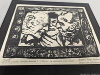 Close-up of print showing three faces, decorative border and pencil signature lower right.