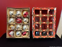 Top view of 12 assorted glass Christmas ornaments in original Woolco box with holly berry design.