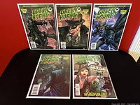Five Green Hornet comic books displayed, with Blood Ties and Year One series visible.