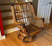 Front angled view showing the bamboo frame, woven rattan sides, and reinforced bindings.