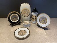 Full set of 8 Chokin style ceramic pieces with gold edging including vase, plates, canister, and jar arranged together on display