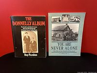 Front covers of both history books showing title, author, and cover photos