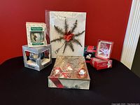 View of all items including Canadian Alderbrook star tree topper, tinsel bulbs, and boxed Hallmark ornaments