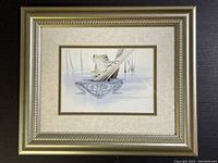 Full view of framed watercolour painting of a green frog on a wooden stick with water reflection in tribal art style.