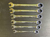 Full set of 6 Goodyear Racing ratcheting combination wrenches laid out side by side.