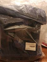 Photo of sealed Roots rolling bag in plastic packaging with visible barcode label.