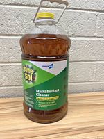 Front view of Pine-Sol Multi-Surface Cleaner Concentrate 144 oz bottle with label showing brand and product details