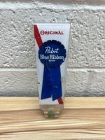 Front view of the Pabst Blue Ribbon original tap handle showing the logo and design details.