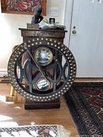 Full front view of oak cabinet, stamping dial, and clock face