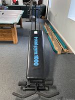 Top view of black padded bench with Total Gym 1000 logo