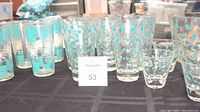 Wide view of all tumblers and shot glasses showing starburst and polka dot patterns