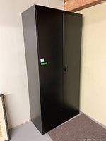 Front view of closed cabinet showing exterior finish and doors locked