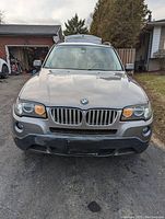 Front view showing kidney grille, headlights and front bumper with minor scuffs