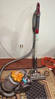 Full view of assembled canister vacuum with hose, wand and floor head