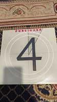 Front cover of Foreigner 4 album showing large number 4 and Foreigner title.