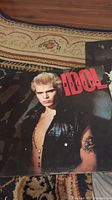 Front cover of Billy Idol vinyl record album showing artist portrait and title.
