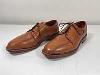 Pair of brown leather Allen Edmonds Hillcrest men's shoes in size 10.5 D, shown together from a three-quarter angle.