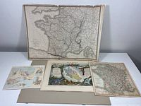 Front view of the four maps spread out showing size and condition