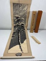 Full view of scroll unrolled with storage box and cover visible