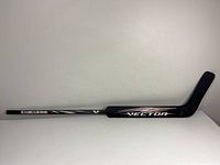 Full length of the black CCM Vector goalie hockey stick with Olaf Kolzig's name.