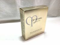 Gold box of Cle De Peau Beauté makeup remover towelettes shown front angled view on white background