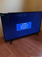Front view of the 48-inch flatscreen TV displaying 'No Signal' on the screen.