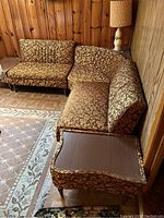 Sectional arranged in basement corner showing two straight sections and right end table