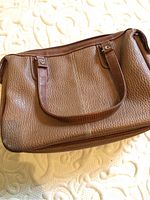 Brown textured faux leather handbag with double handles, showing front and texture details