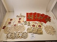 Full lot of 28 new Christmas craft ornaments including various wooden cutout shapes and photo frames shown on white background.