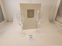 Two Avon Hummingbird Collection champagne flutes with original box.