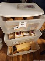 Full view of Sterilite 3-drawer plastic storage organizer with visible craft supplies inside drawers.