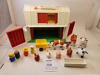 Full set with barn, figures, animals, and cart arranged to display entire lot contents