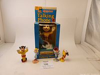 Mighty Mouse Talking Phone in original box with four accompanying figures (Mighty Mouse, Scrappy, Girlfriend, Dynamite Dasher) displayed in front.