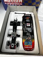 Top view of Elvis Presley racing car and trailer in white foam-lined box.