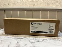 Box of Lexmark C540X75G One Waste Toner Bottle with branding and label visible.