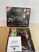 Box top for VisionTek Radeon HD 3870 showing product details and branding.