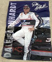 Full view of the vintage vinyl poster featuring Dale Earnhardt in racing suit and car with signature and branding visible.