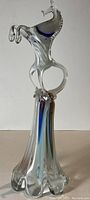 Front view of the complete glass horse sculpture on pedestal